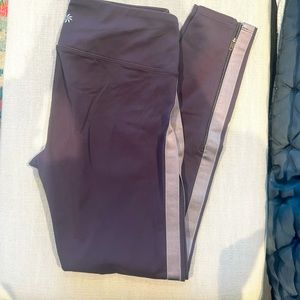 Athleta size small purple legging. Velvet stripe/zipper detail